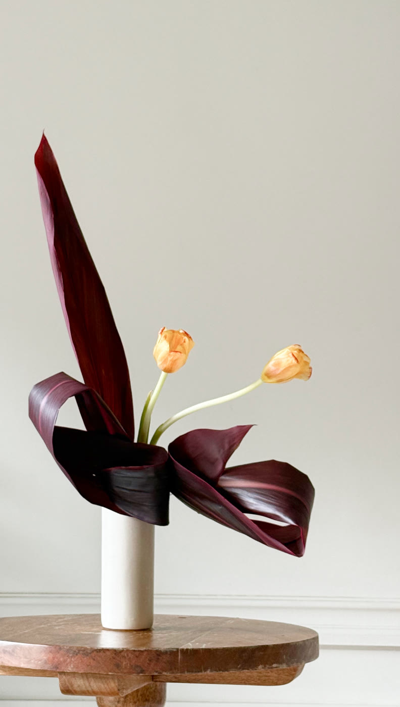 Ikebana arrangement in a ceramic vessel