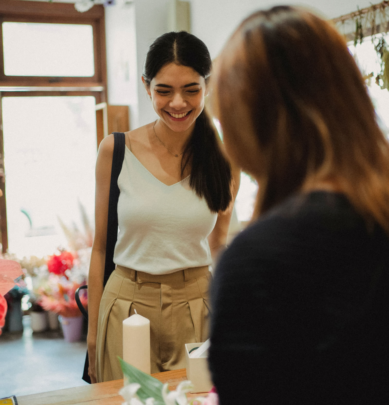 Guests arriving at a workshop table with fresh stems